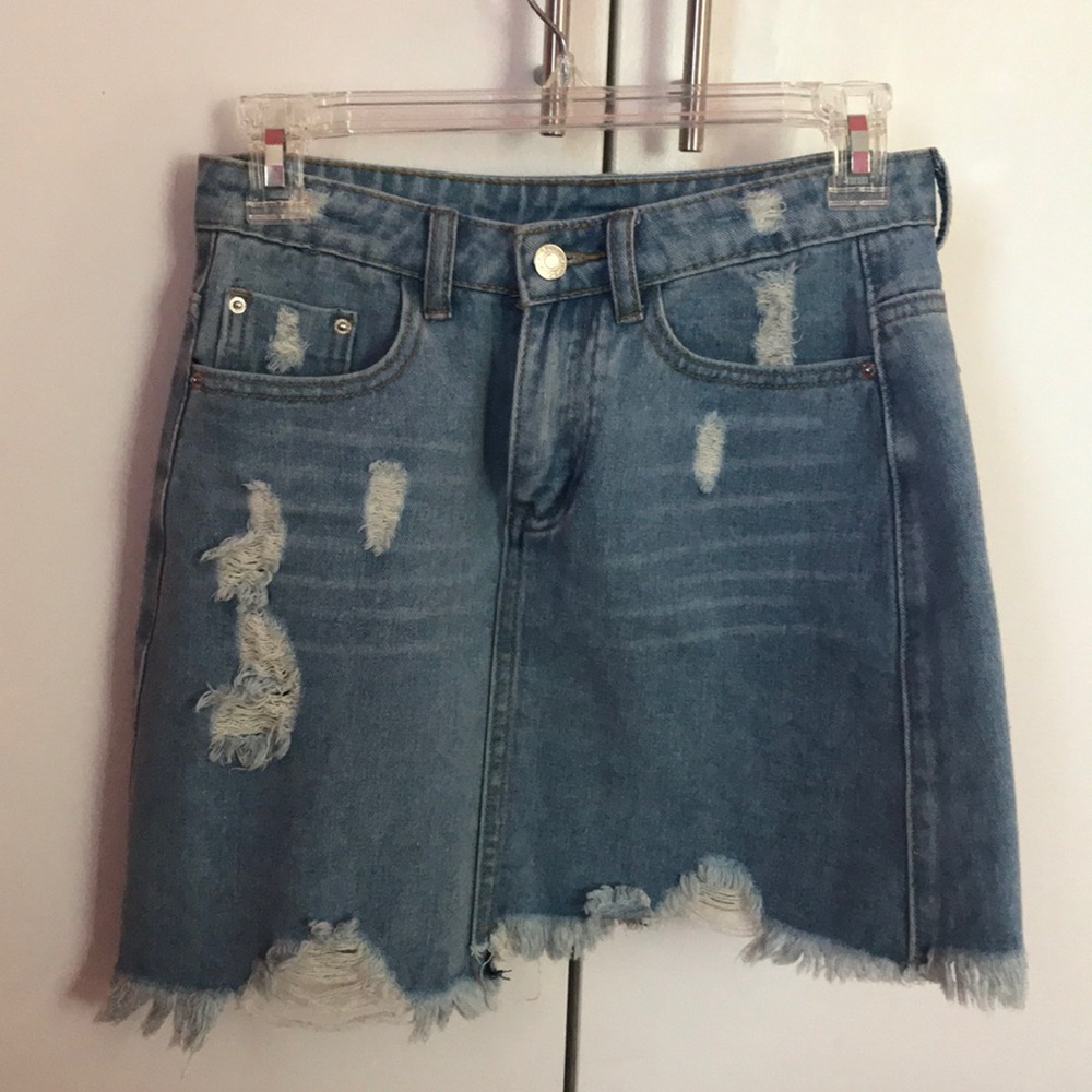 Ripped blue jean skirt with a frayed bottom